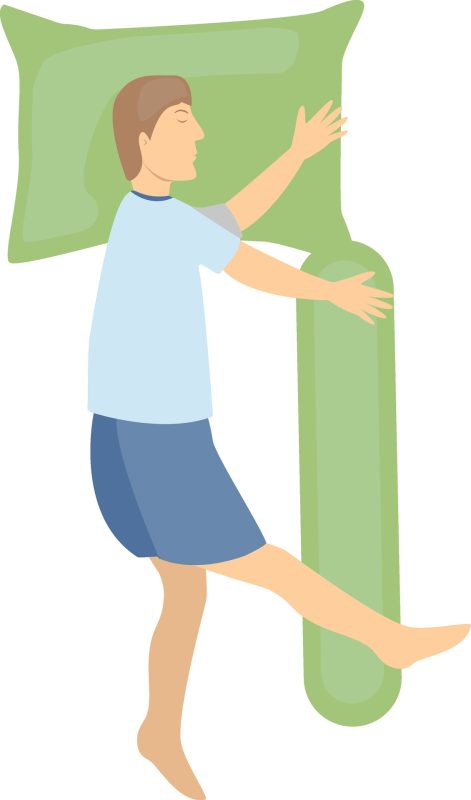 Man sleeping on his side with additional pillows